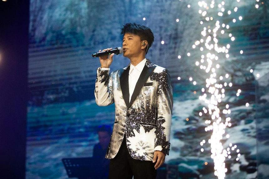 Concert review: Cantopop superstar Hacken Lee charms with cool charisma,  stage experience | The Straits Times