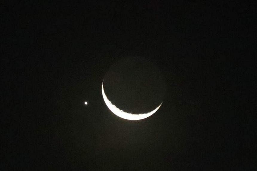 Planet of love Venus sidles up to glowing crescent moon in Singapore night  sky