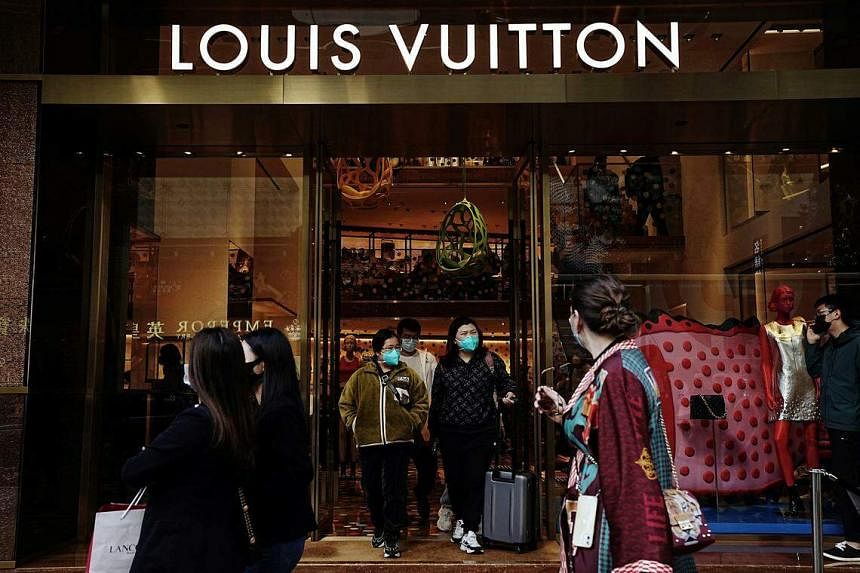 Luxury group LVMH's sales defy downturn as shoppers splurge