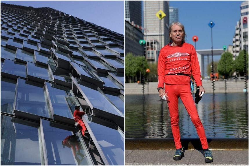 French Spiderman climbs Paris skyscraper as protest against