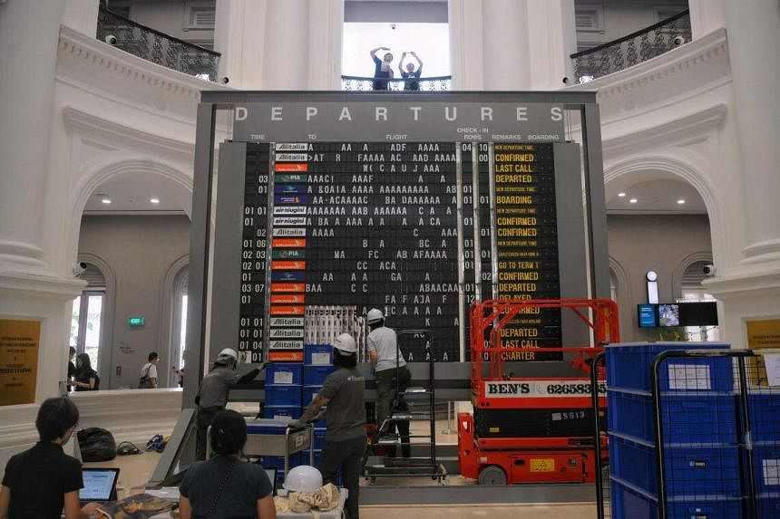 Singapore - Jun 27, 2017 : Flights Information Board And Machine At Changi  Airport Terminal 3.Young Girl With Her Mother Touching Self Check In Kiosks  Interactive Screen To Check In Online. Stock