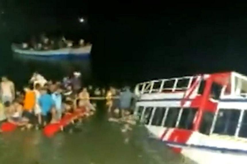 Rescuers search for victims of capsized tourist boat in India; 22 dead ...