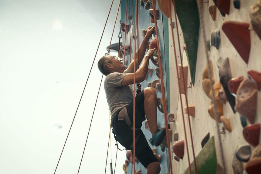 Seniors try climbing Releasing the rock wall akin to learning to let
