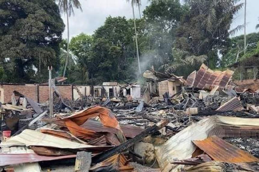 Malaysian dad throws sons from upper floor of burning building to save ...