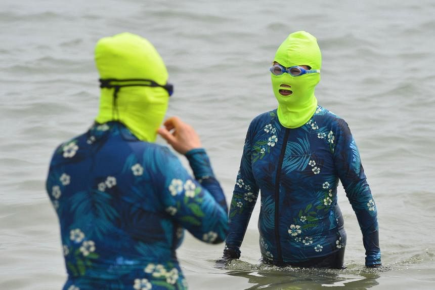 Sun jackets, face-kinis and personal fans: Chinese turn creative