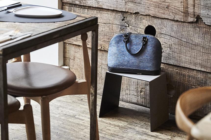 More restaurants are adding tiny purse stools for big luxury handbags