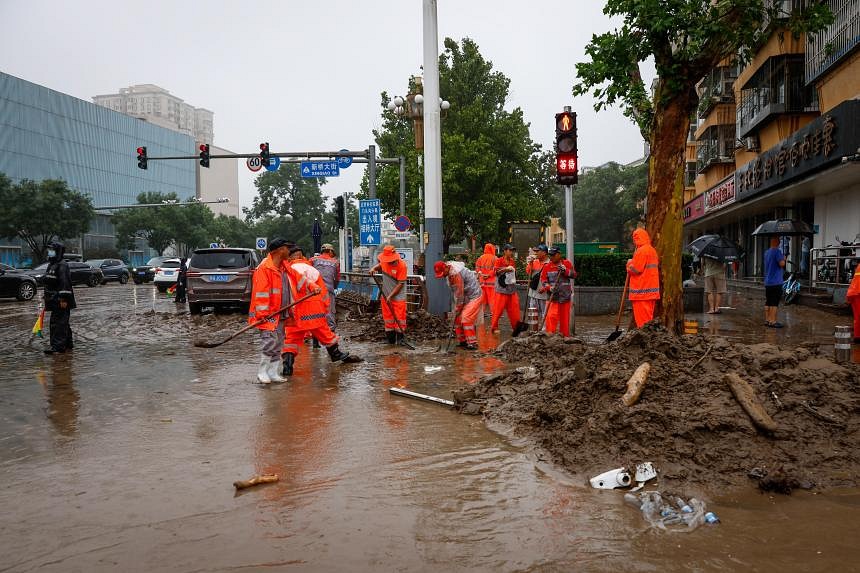 Military helicopters deliver aid to Beijing flood victims in the wake