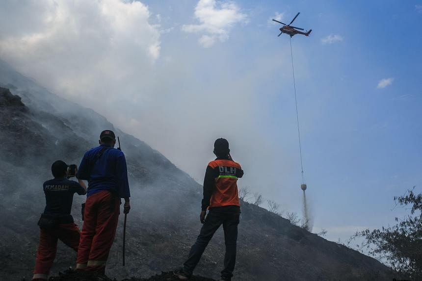 Dry season causes landfill fires in central and western Java