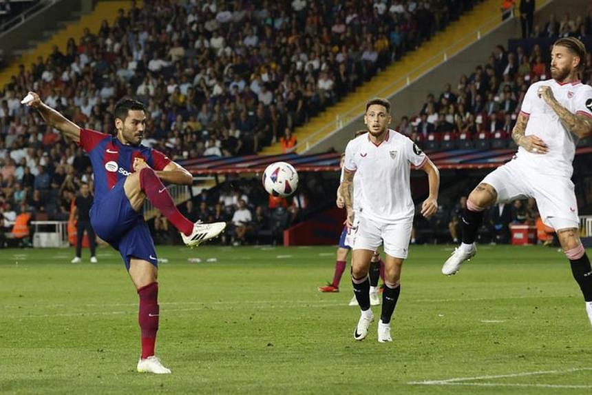 Sergio Ramos' own goal gifts Barcelona victory over Sevilla in La Liga