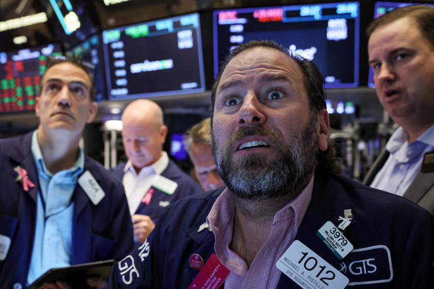 Wall Street ends lower on mixed earnings, robust data | The Straits Times