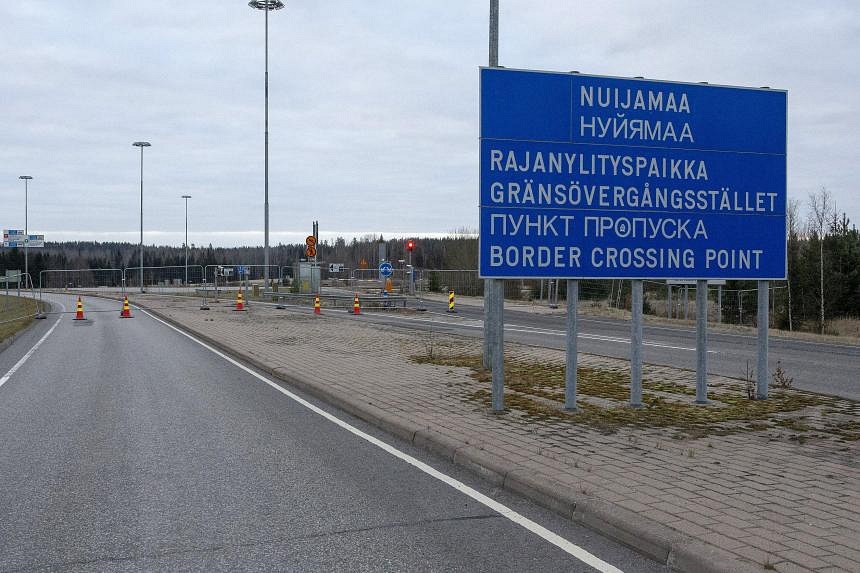 Dozens of migrants wait at Finland-Russia border after Helsinki blocks ...