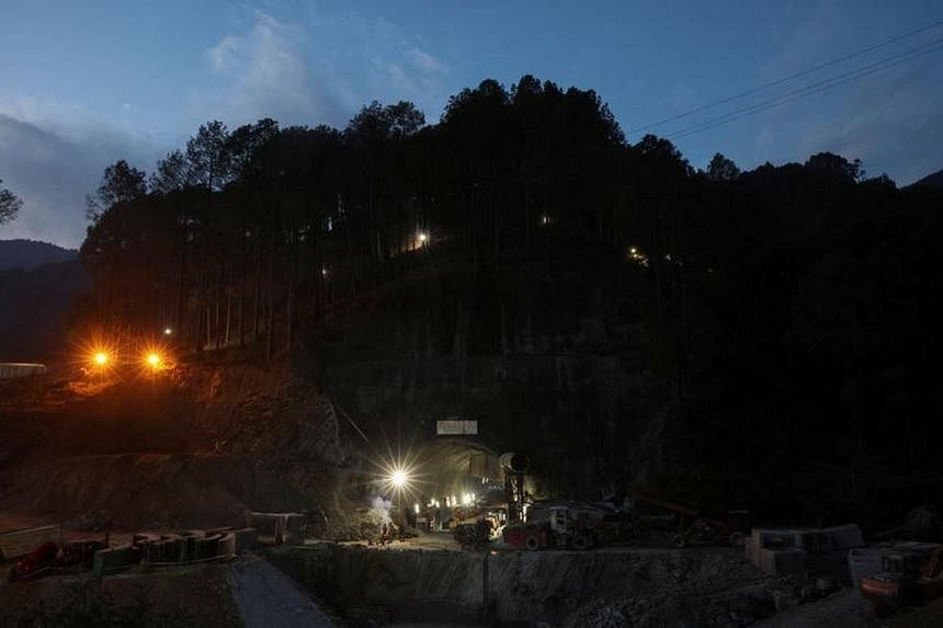 Indian rescuers say very close to reaching 41 men trapped in tunnel