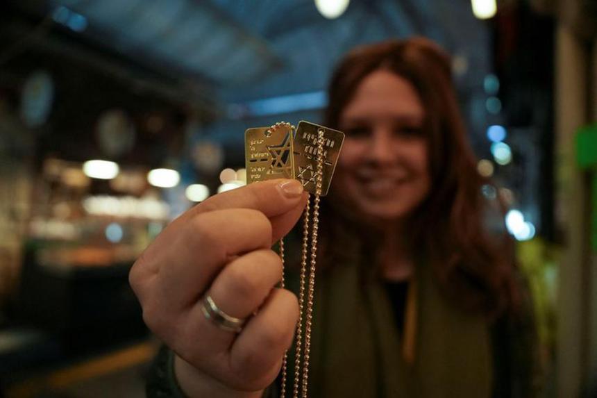 Israelis wear dog tags in solidarity with hostages and each other | The ...