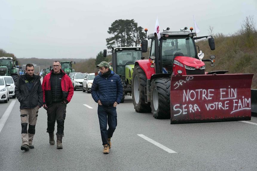 French farmers block highways around Paris as protest reaches capital