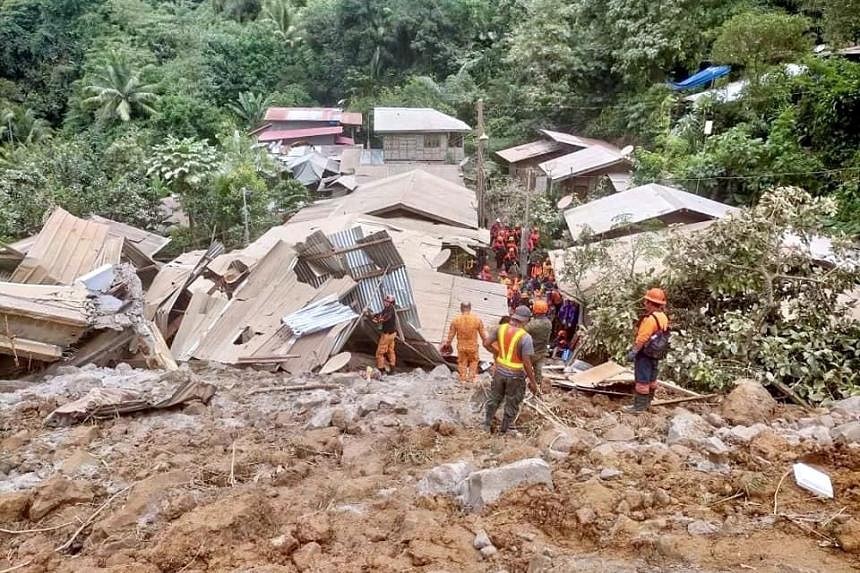 Rescuers use bare hands to search for Philippine landslide survivors ...