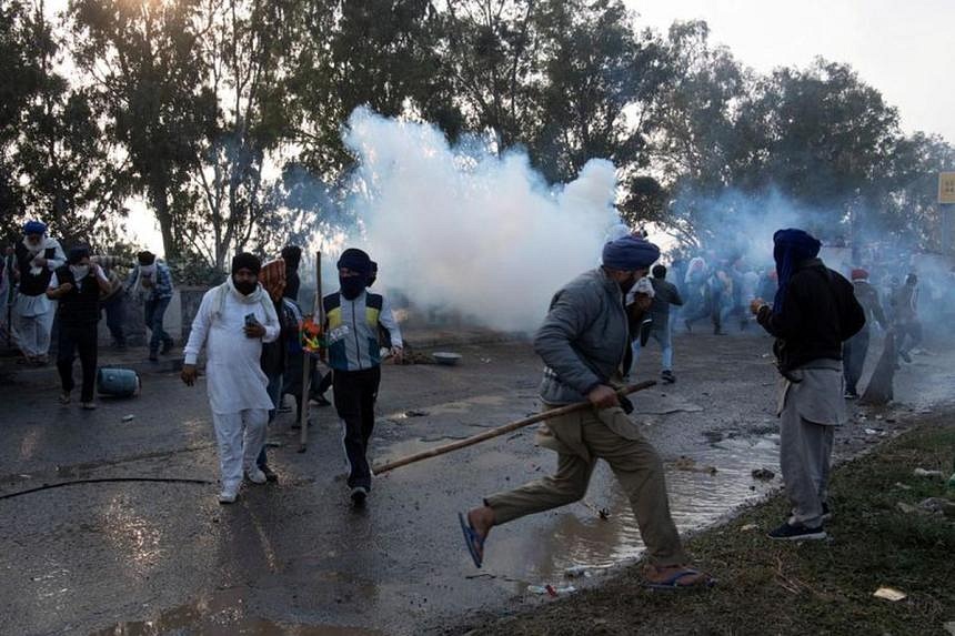 Indian security forces fire tear gas at farmers in protest march to New Delhi | The Straits Times