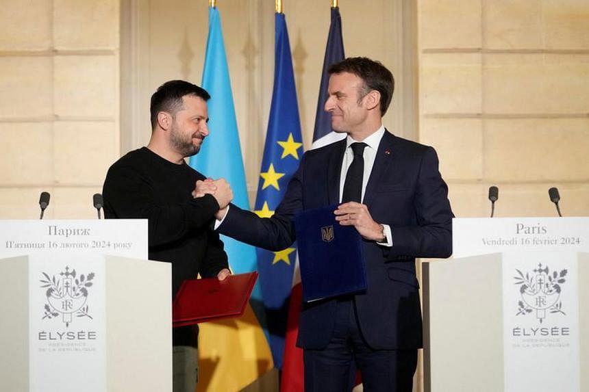 Ukraine's Zelensky signs French security deal after 'historic' German pact  | The Straits Times