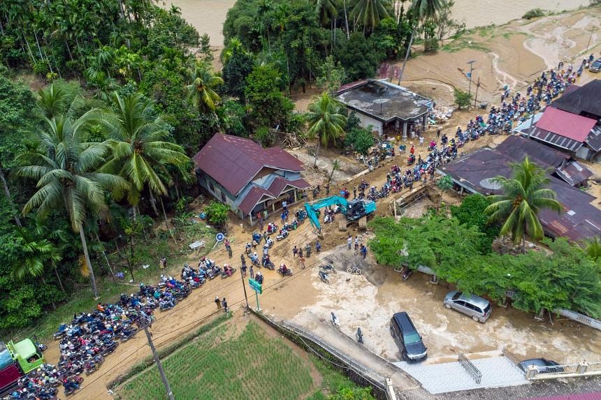 Death Toll From Indonesia Floods, Landslides Rises To 21 | The Straits ...