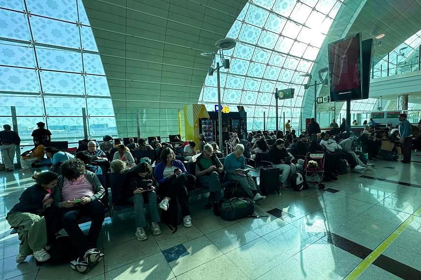 Emirates suspends flights transiting through Dubai after storm | The ...