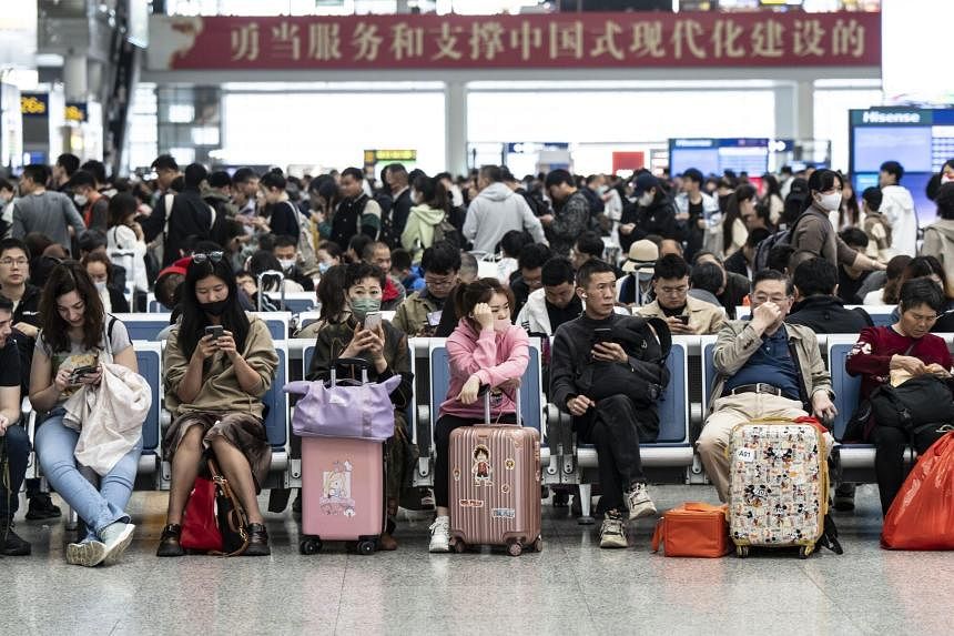 China travel surges for May holiday but consumers remain wary