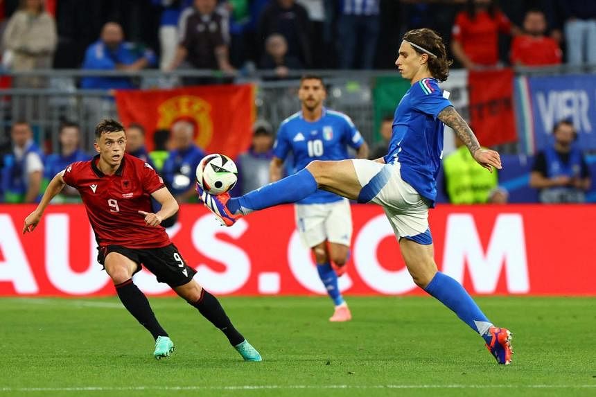 Italy recover from early shock to beat Albania