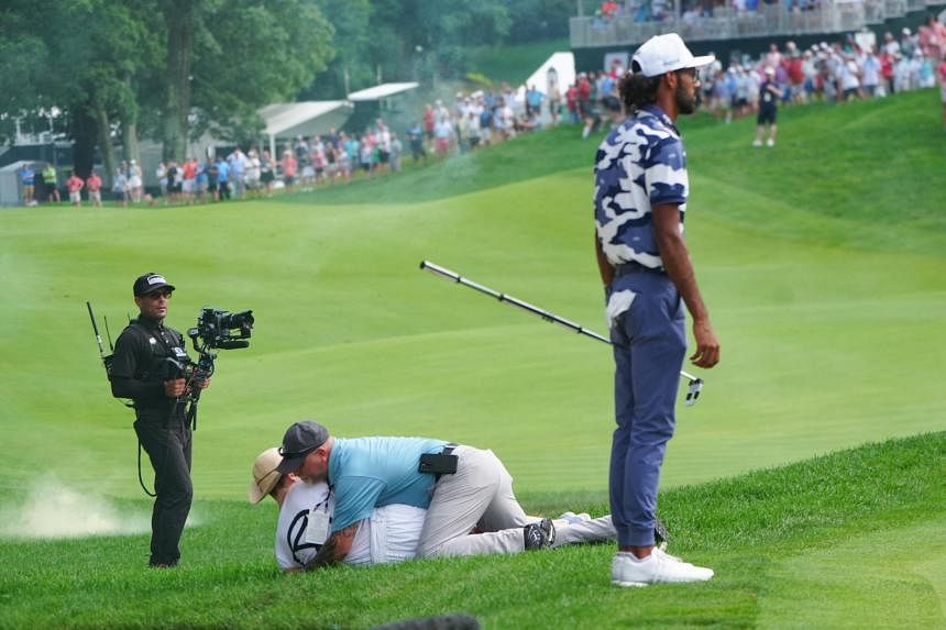 Protestors rush 18th green, disrupt end of golf’s Travelers Championship