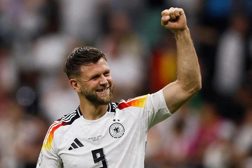 Fuellkrug's late header fills coffers for Germany team mates with
