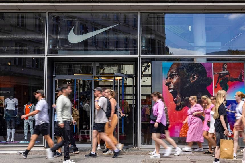 Nike shares plunge after sneaker maker forecasts 10% drop in quarterly revenue