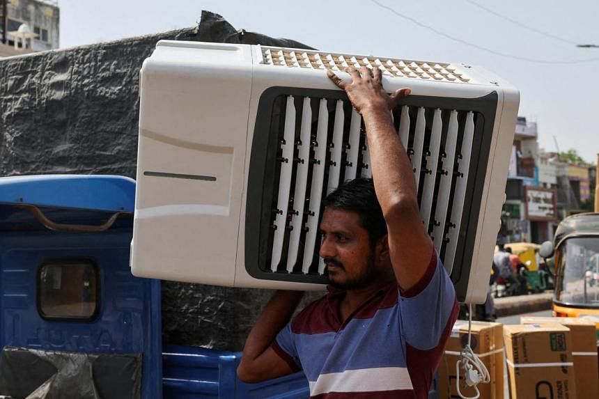 Indians battle intense heat with 'mad rush' for air conditioners, beer