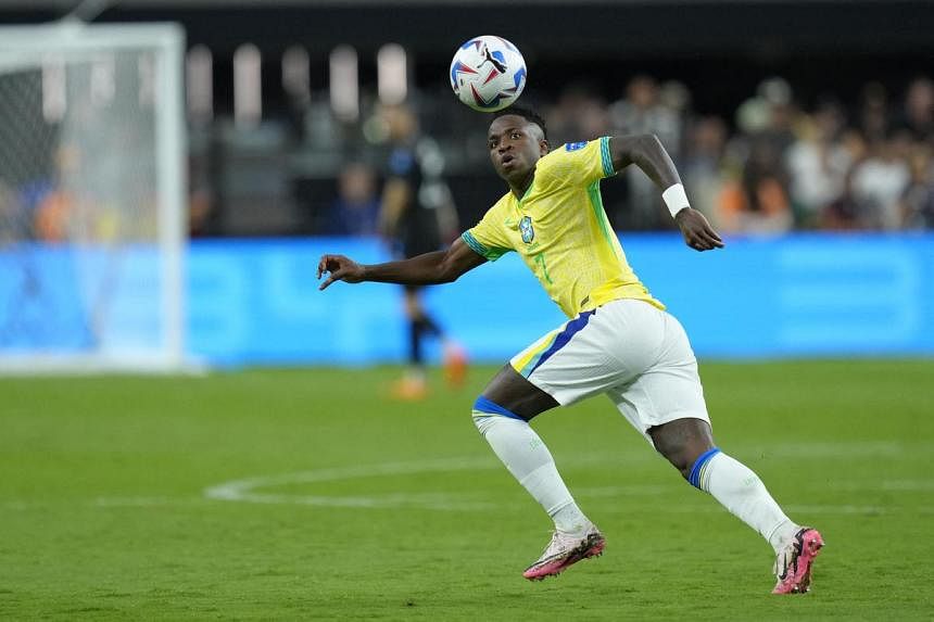 Soccer-Vinicius unleashed boosts nervy Brazil to much-needed win