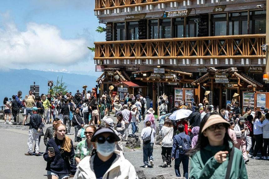 crowd control at japan’s mount fuji as hiking season begins