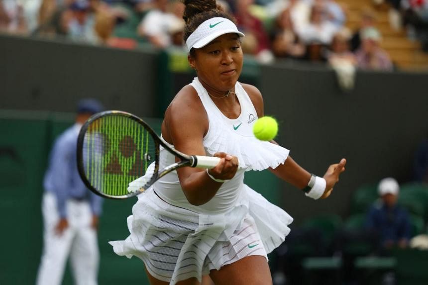 Osaka wins see-saw match to reach second round at Wimbledon