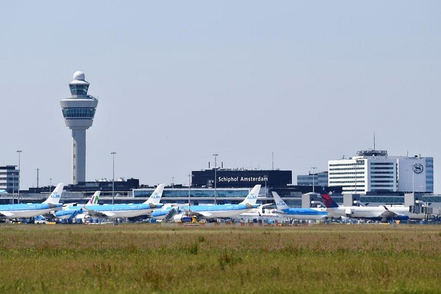 Dutch court says government must follow EU procedure to reduce flights at Schiphol airport