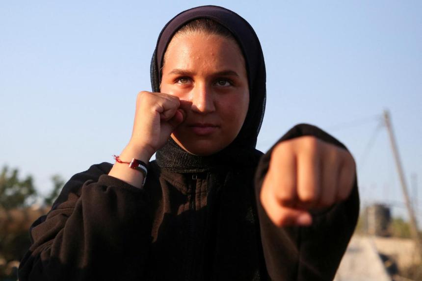 As bombs shatter Gaza, boxing coach emboldens girls