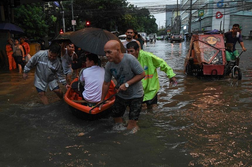 Typhoon Gaemi Sinks Huge Swathes Of Philippine Capital; At Least 14 ...