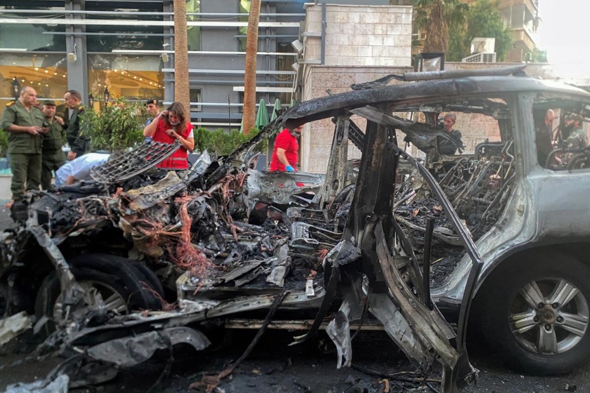 Two killed in missile attack on car in Syrian capital, state media say