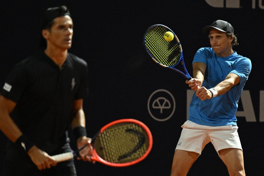 Former Uruguay footballer Diego Forlan swings and misses as tennis debut ends in defeat