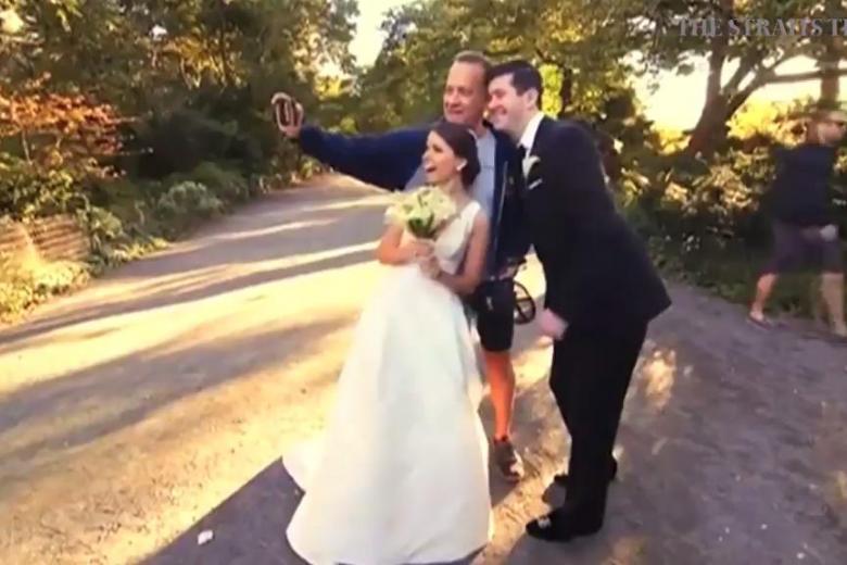 Tom Hanks crashes Central Park wedding photo shoot, to delight of