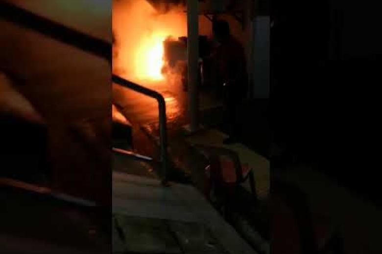 Passersby douse huge flames outside shop unit after aircon compressor catches fire in Redhill