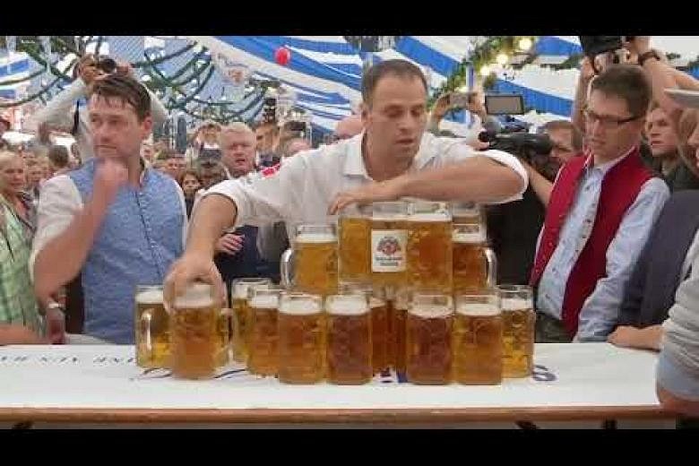 German sets new world record for carrying beer steins | The Straits Times