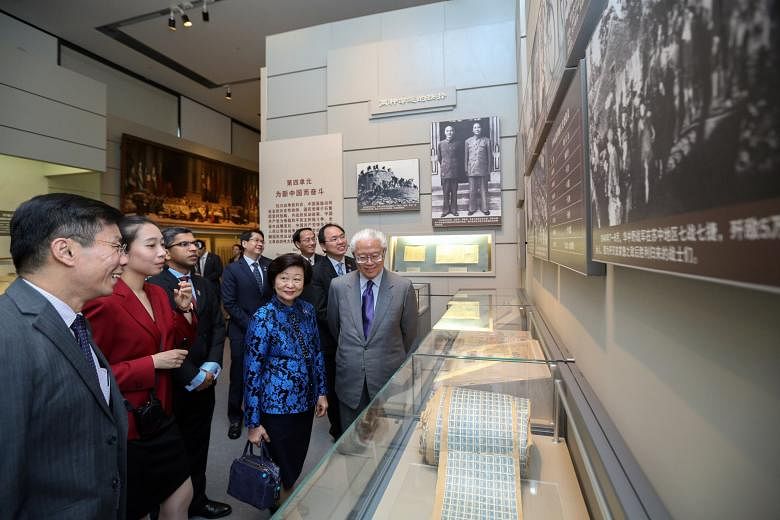 Singapore President Tony Tan Keng Yam and his wife Mary being given a tour of the National Museum of China yesterday.