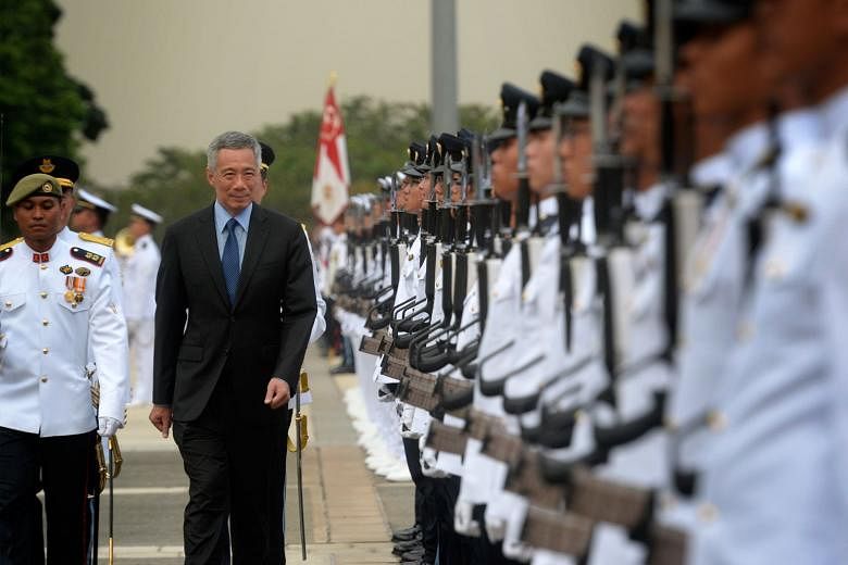 Yesterday's SAF50 Parade, which commemorated the five decades of the Singapore Armed Forces' existence, was officiated by Prime Minister Lee Hsien Loong. Unlike the usual annual SAF Parades, this year's event saw the attendance of pioneer SAF troops,