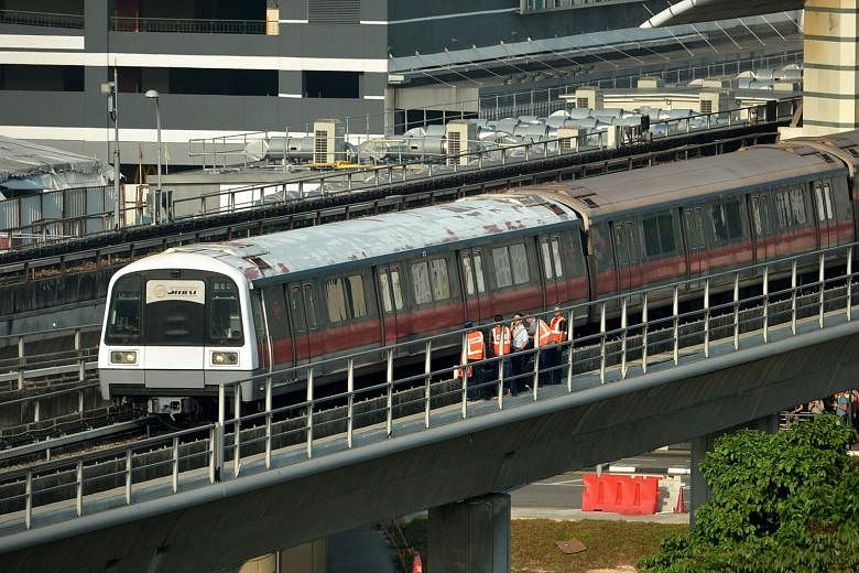 A train at Woodlands station yesterday. A fault between the Woodlands and Admiralty stations resulted in trains slowing down.