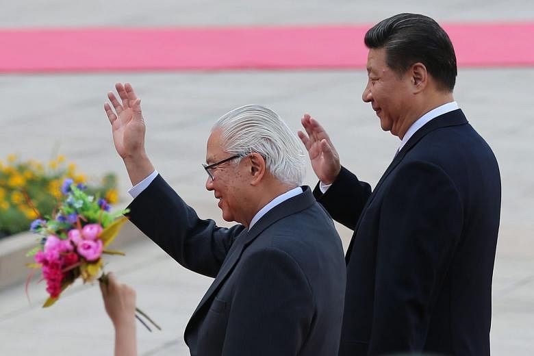 ABOVE: President Tony Tan Keng Yam meeting Premier Li Keqiang (second from right) at the Great Hall of the People in Beijing yesterday. LEFT: Dr Tan with Chinese President Xi Jinping during a welcome ceremony at the Great Hall of the People.