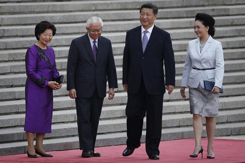Singapore President Tony Tan and his wife Mary with Chinese President Xi Jinping and his wife Peng Liyuan at a ceremony outside the Great Hall of the People in Beijing on Friday. Dr Tan stressed that the Republic has to evolve to deal with the changi