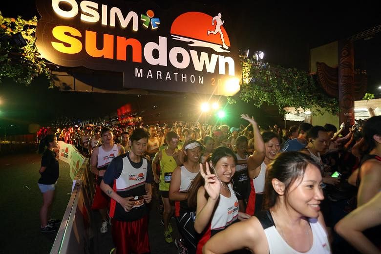 Participants of the 10km race at the Osim Sundown Marathon moving off from their starting point at the F1 Pit Building at 10pm last night. The 10km race followed a 5km fun run, introduced for the first time. Into its eighth edition, Singapore's bigge