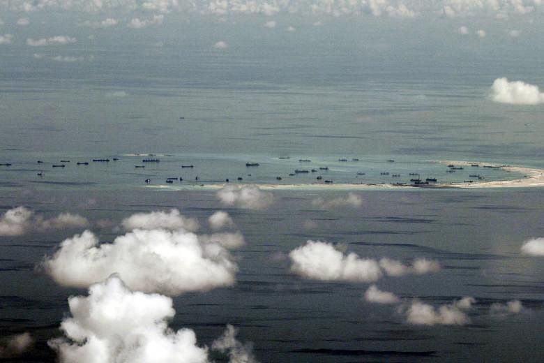 An aerial photo taken in May from a Philippine military plane shows the alleged on-going land reclamation by China on Mischief Reef in the Spratly Islands.