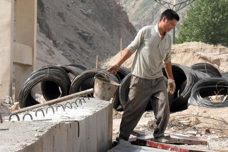 A Chinese worker at a road construction site between Dushanbe and Khujand in Tajikistan. The Central Asian country, once an outpost of the former Soviet Union, in increasingly dependent on China.