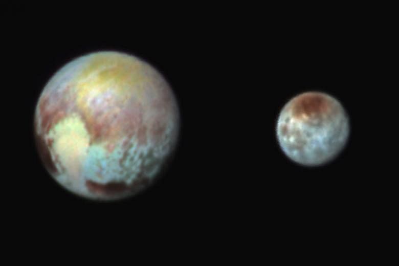 A handout from Nasa (far left) shows Pluto and its largest moon Charon in false colour image. Charon is shown to have canyons and cliffs. A close-up image (left) from Nasa of a region near Pluto's equator reveals a giant surprise: a range of youthful