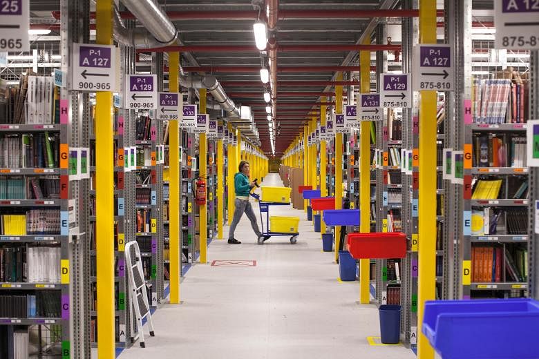A worker at the Amazon.com fulfilment centre in Poznan, Poland. Amazon shares jumped as much as 19 per cent after it reported on Thursday that second-quarter revenue rose 20 per cent to US$23.2 billion (S$31.8 billion).